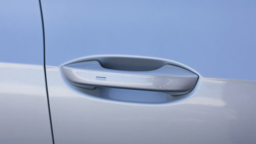 Here’s What That Small Button On Your Car Door Handle Is For