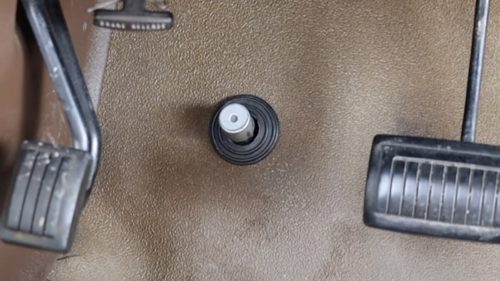 Here’s What The Little Button On The Floor Of Old Classic Cars Is For