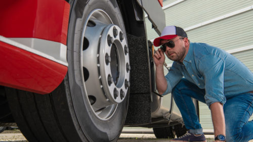 How To Signal A Trucker If You Spot A Problem With Their Rig