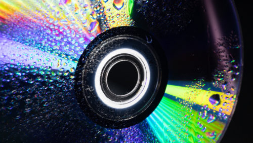 Why Do CDs Reflect Light In Rainbow Colors?
