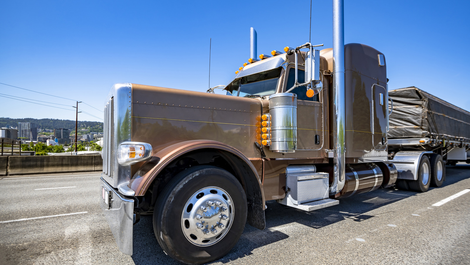 What Are Those Silver Cylinders On The Side Of A Semi-Truck For?