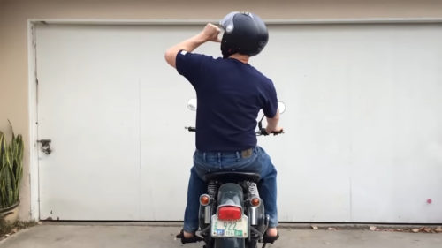 Here’s What It Means When You See A Biker Point Their Thumb At Their Helmet
