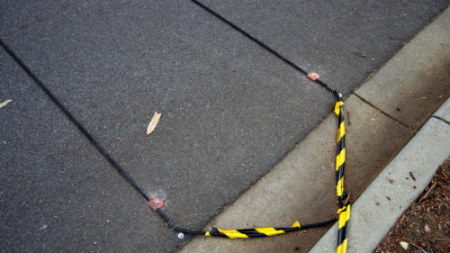 Here’s What Those Black Cables On The Road Are Actually For