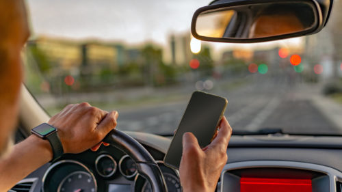 Is It Legal To Check Your Phone At A Red Light? Here’s What CA Law Says