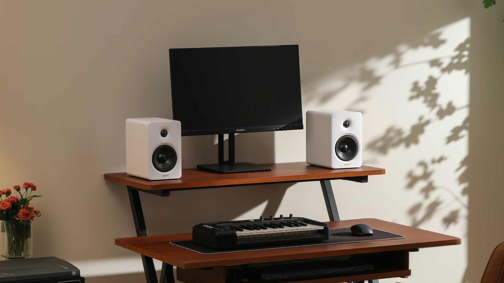 These understated new desktop speakers have one little feature that’ll make them rival your TV’s soundbar