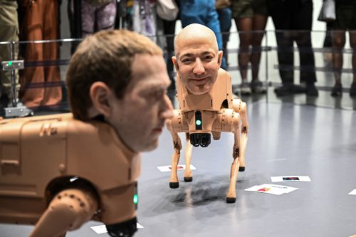 ‘We should be interested in what these people are like and how they behave’: these AI slop-pooping robot dogs with the heads of Musk and Bezos by the artist Beeple can be seen in a Berlin museum — and