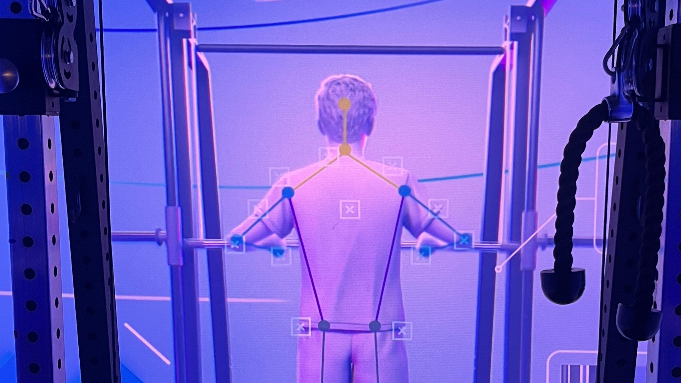 ‘This just knows so much more than a human ever could’: Meet CoachCube, the intelligent AI personal trainer that lives inside a Tron-style box room