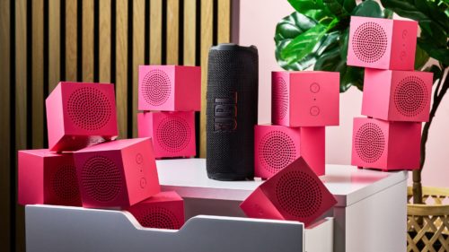 “An enormous cityscape of stackable guava-colored boxes” — I compared a dozen $10 IKEA speakers to one $120 JBL speaker to see whether sheer numbers are a substitute for better sound engineering