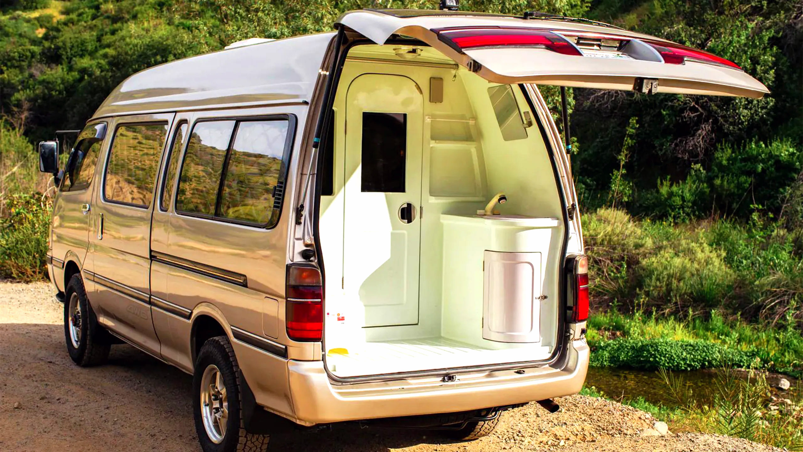 This $18K Toyota Van Hides A Private Bathroom With A Shower In The Back | Carscoops