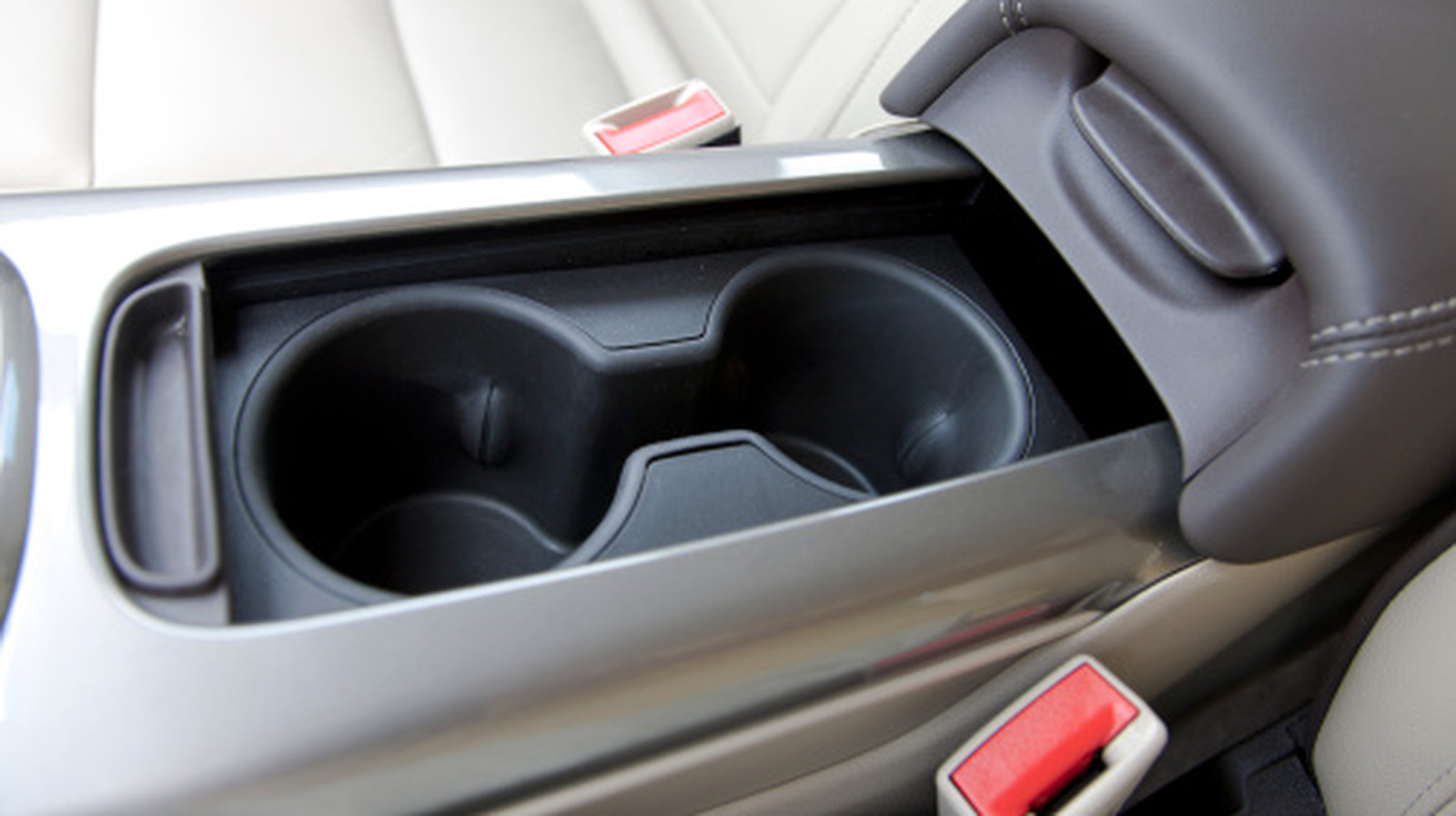 This May Be What The Gap In Between Your Car’s Cup Holders Is Actually For