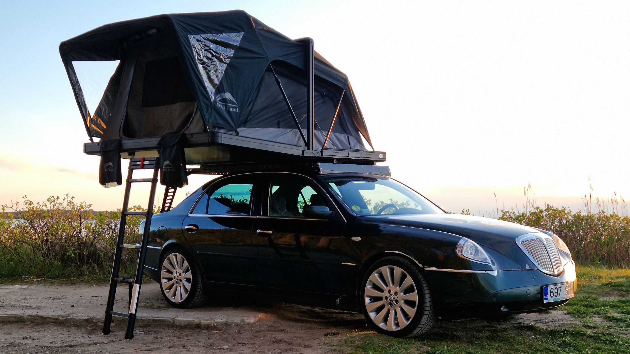 This Lancia Was Built For Italian Politicians, Now It Sleeps Two In A Field | Carscoops