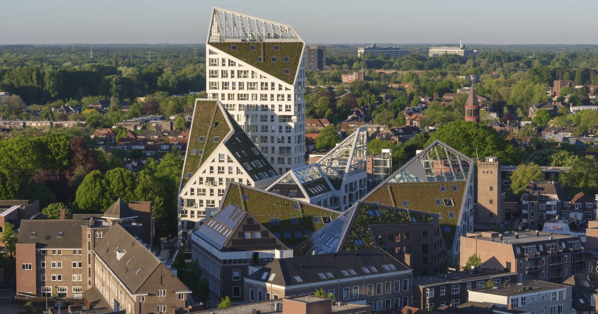 Dramatically angled green roofs reshape urban housing