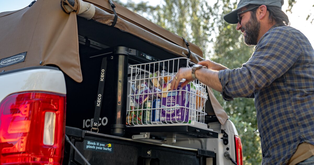 Slick, self-sliding base camp fridge uses trap door for fast access