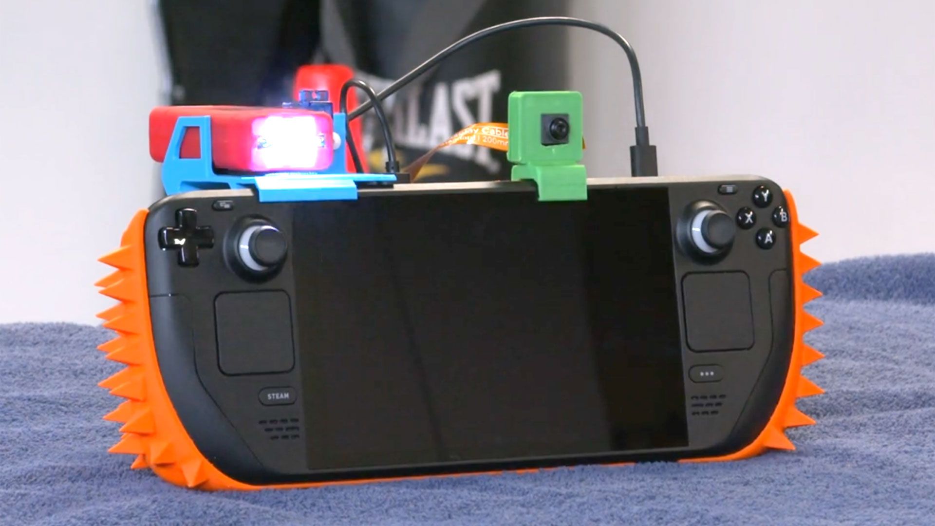 Disgruntled gamer builds booby-trapped Steam Deck with 3D-printed spikes and a built-in taser — Raspberry Pi powers speaker, camera, and alarm to stop family members draining his battery