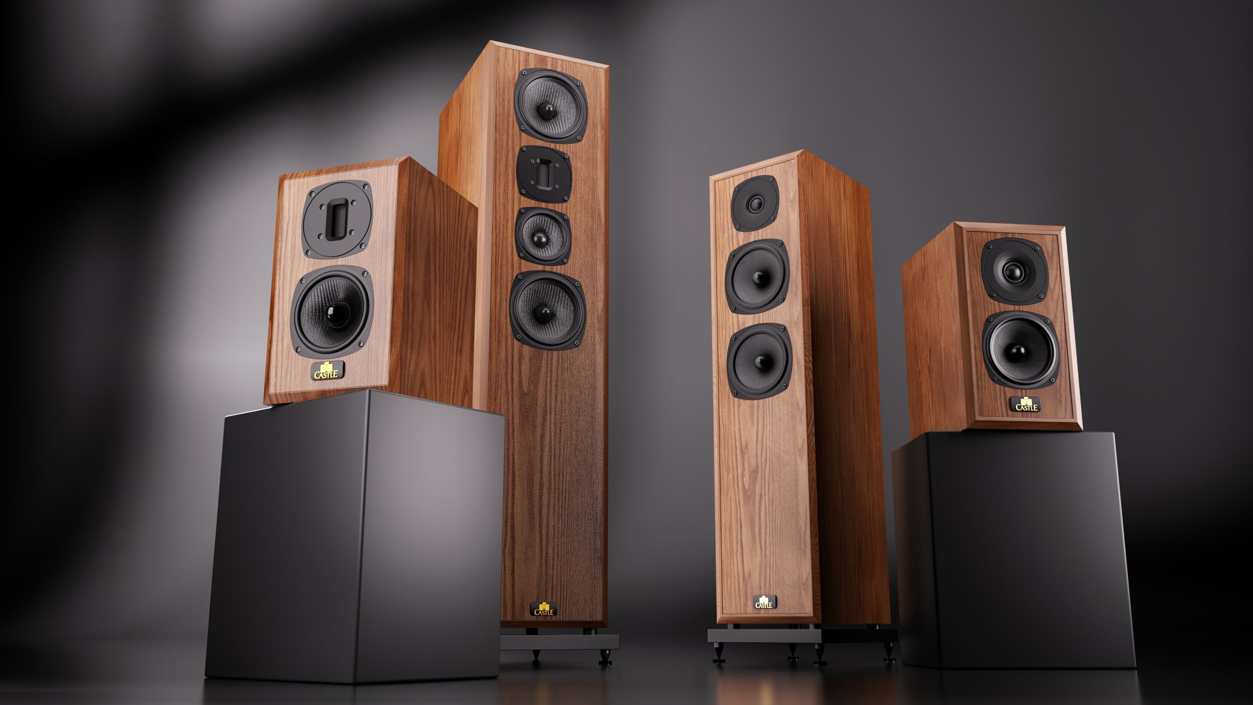 I love the look (and unusual driver layout) of these retro-inspired wood-on-wood British stereo speakers