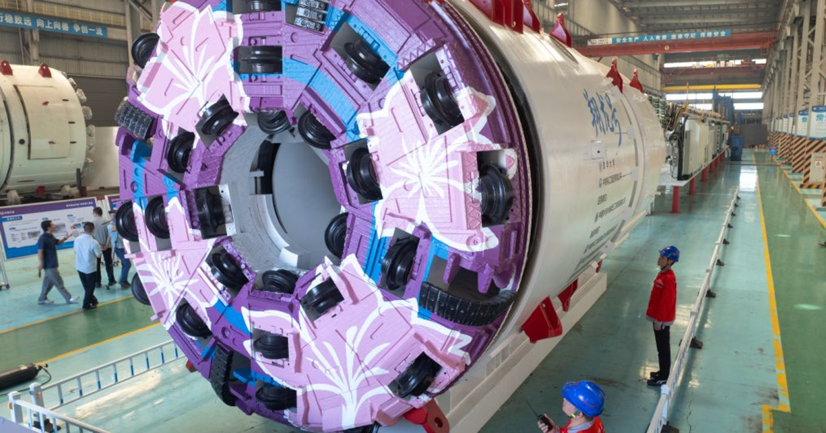 China’s colossal tunneling machine bores AND blasts through raw ground