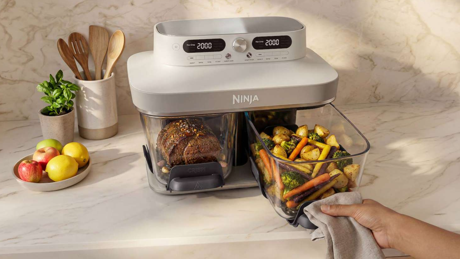 Tired of soggy dinners? The new Ninja Crispi DualZone air fryer has two separate cooking zones, and uses non-toxic glass dishes that you can take from freezer to table