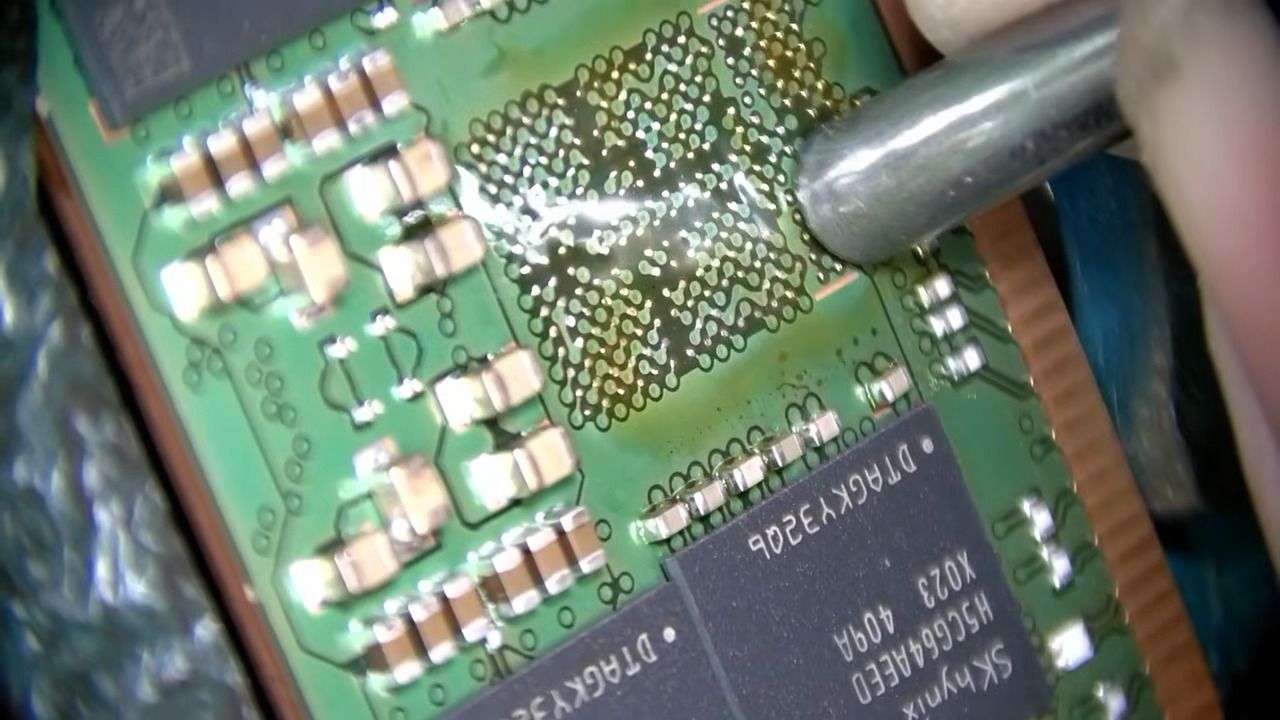 Customer sends two-stick $16,000 DDR5 memory kit to repair shop — soaring replacement costs make DIMM repairs viable, technician revives dead module with hot-air reflow and new PMIC