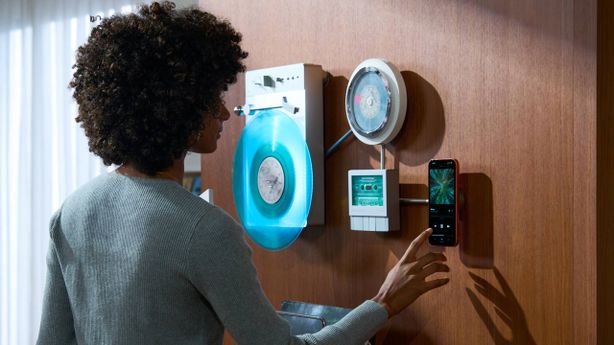 It’s a record, CD and cassette player system that works from your wall — whether we recommend vertical vinyl playback or not