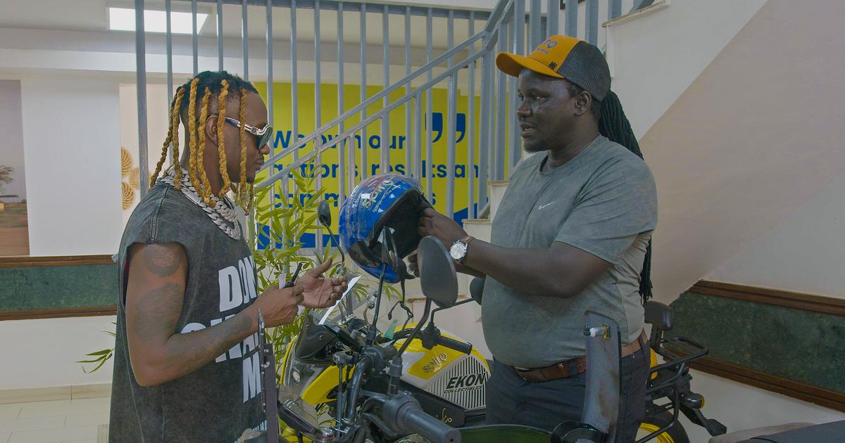 Fik Fameica receives electric motorcycle as Spiro unveils him as East Africa ambassador
