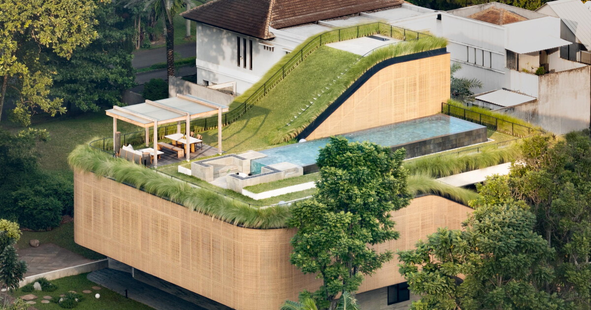 Sloping rooftop garden crowns Indonesian home