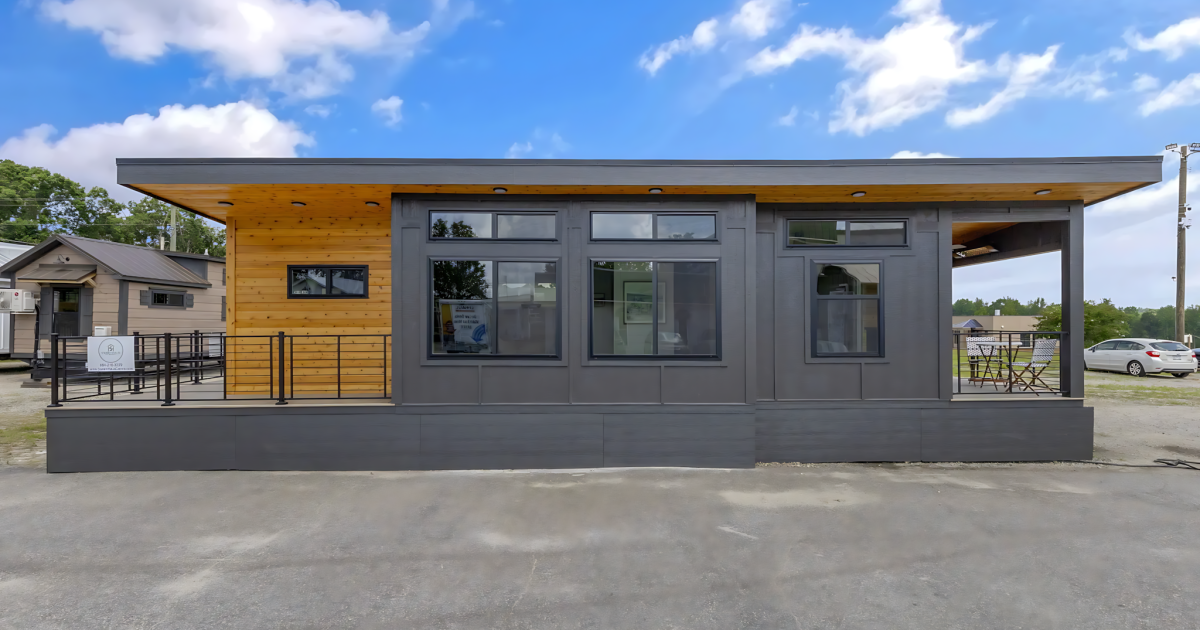 Tiny house spreads out with a pair of porches and a spacious interior