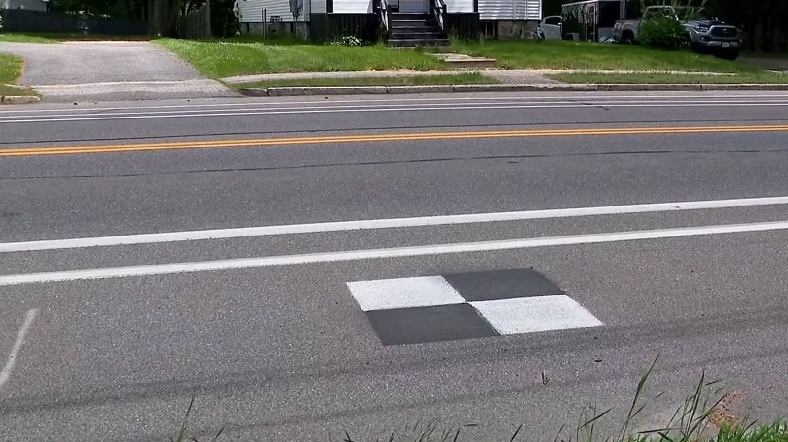 What Are Those Black And White Checkered Squares On The Highway For? – SlashGear