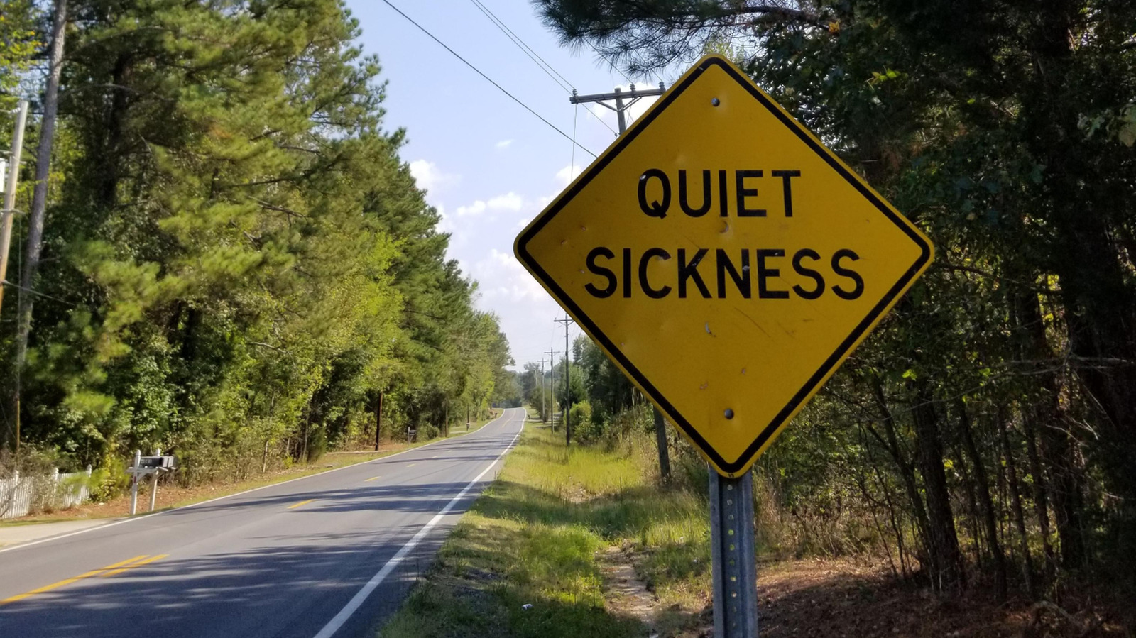What Does A Road Sign That Says ‘Quiet Sickness’ Mean? – SlashGear