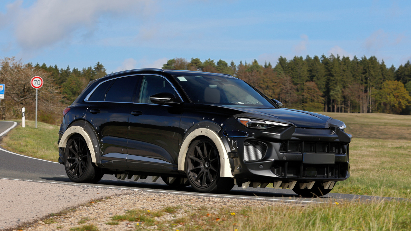Porsche’s Gas Macan Spotted Testing, But What’s With All The Triangles? – SlashGear